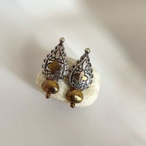 Women’s gold-silver dual-tone studs crafted from fine silver, part of the Tribal Match collection, showcasing modern Indian aesthetics and artisanal craftsmanship.