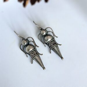 Dragon Inspired Embossed Fly Hooks Earrings with intricate detailing and oxidised silver finish, showcasing a bold and unique design.