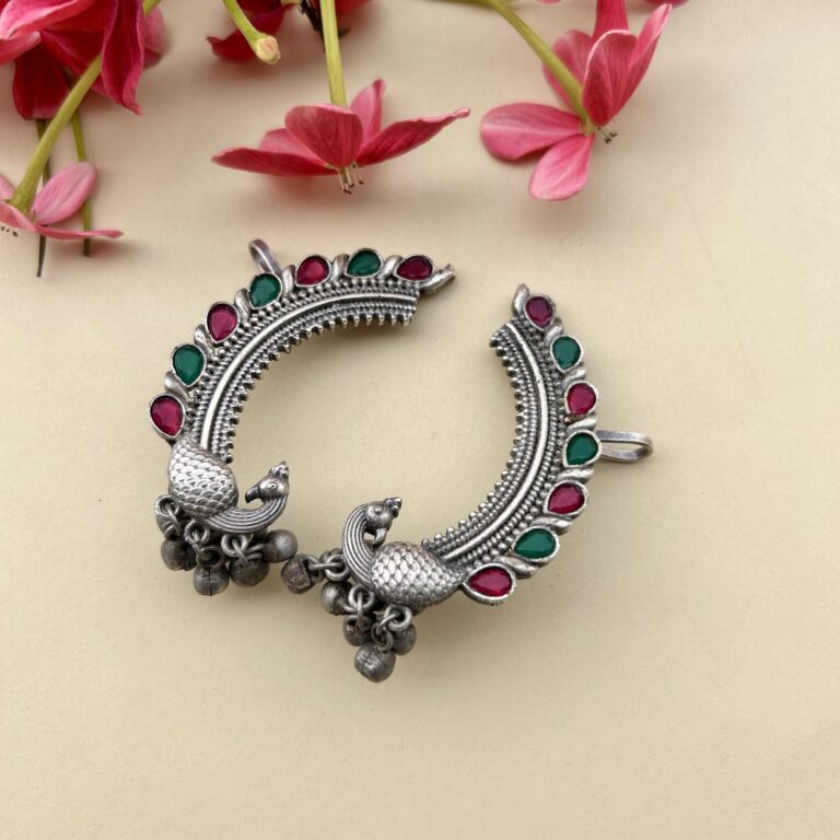 Colorful Peacock Oxidised Ear Cuff for women featuring antique silver finish, vibrant stone detailing, and traditional jhumka accents, perfect for ethnic and Indo-western outfits.