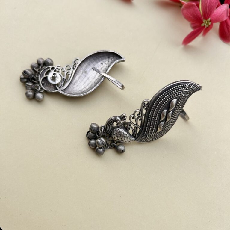 Oxidised Ear Cuffs featuring an antique silver peacock design with leaf-inspired detailing and dangling ghungroo accents, perfect for ethnic and Indo-western outfits.